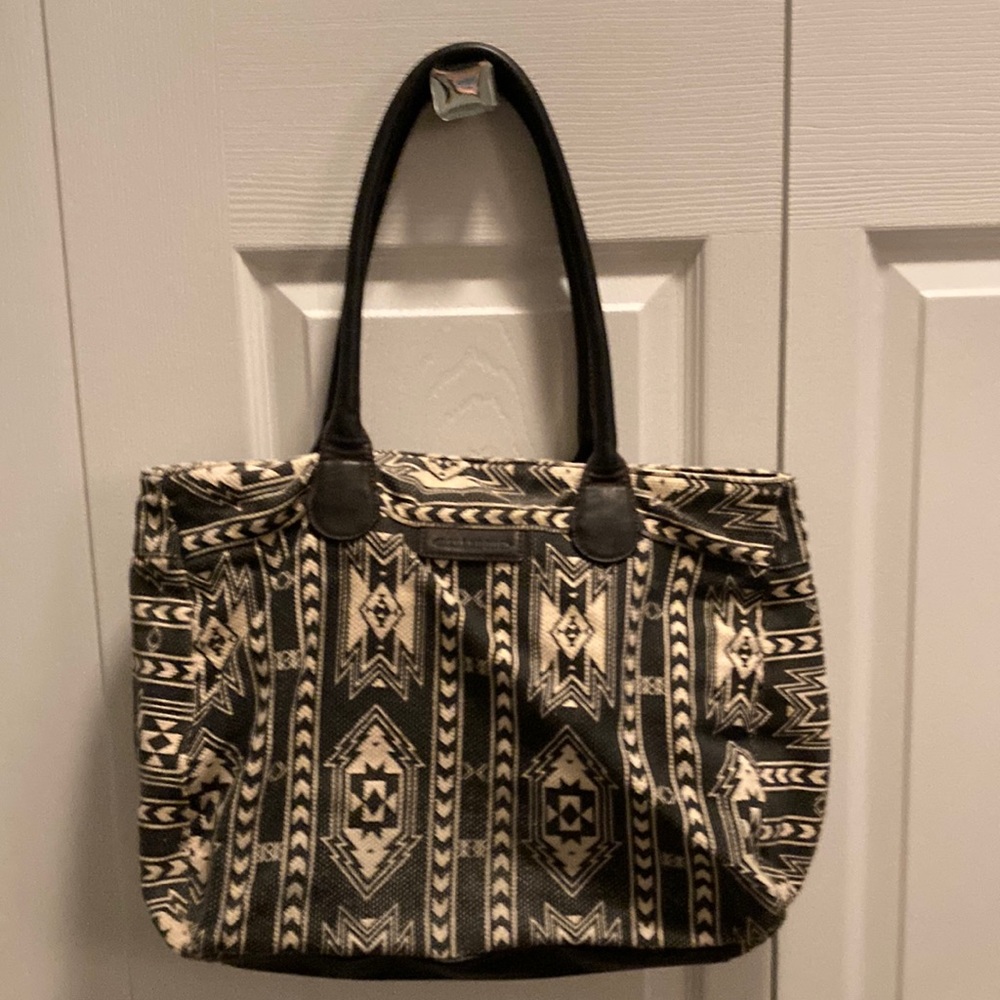 Billabong tote with laptop section. Leather handles and bottom. Great bag!